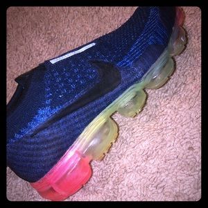 A pair of cute Navy and rainbow vapormax